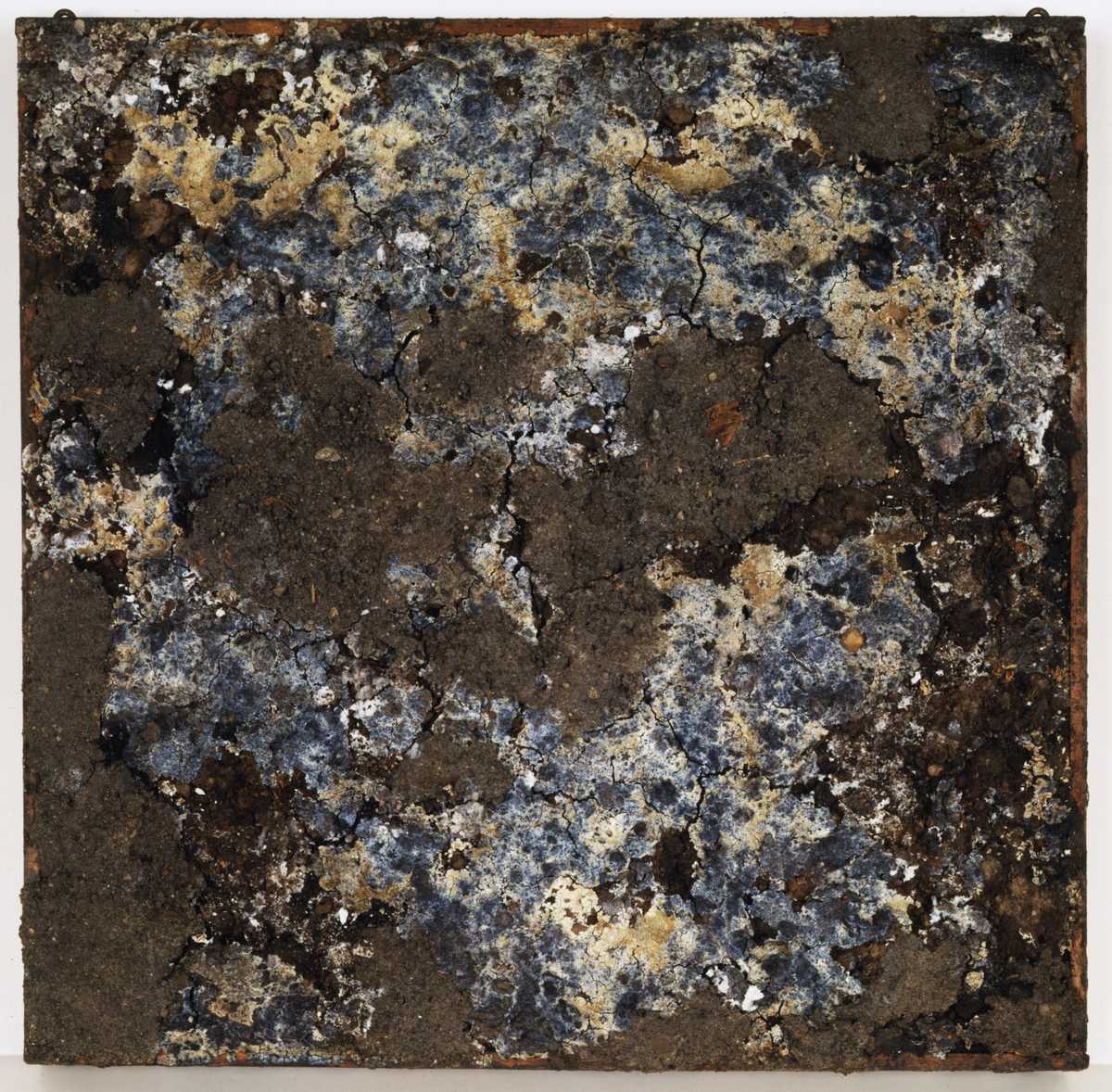 A square artwork that looks like cracked dirt with blue metal and shine showing through.